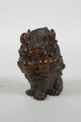 An oriental cast bronze stylised kylin, 6cm high