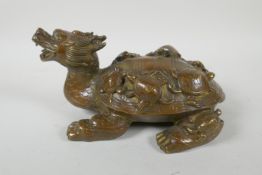 A Chinese filled brass longgui (dragon turtle) with tortoise on its back, Xuande 6 character mark to