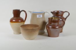 A Doulton Lambeth jug, two lustre jugs, and a Mocha ware jug, 17cm high, and a bowl