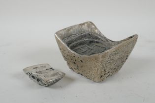 A Chinese white metal trade token/ingot, and another smaller, 10 x 8cm