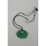 A Nephrite jade pendant necklace, 7 x 5cm