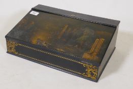 A Victorian papier mache writing slope with gilt decoration in the manner of Jennings &