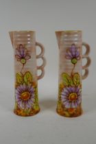 A pair of Royal Art Pottery jugs with floral decoration, 24cm high