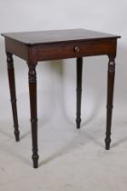A Georgian mahogany single drawer side table, raised on ring turned tapering supports