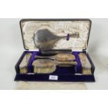 A cased hallmarked silver dressing table set, engraved to backs 'Beryl', maker S. Blanckensee &