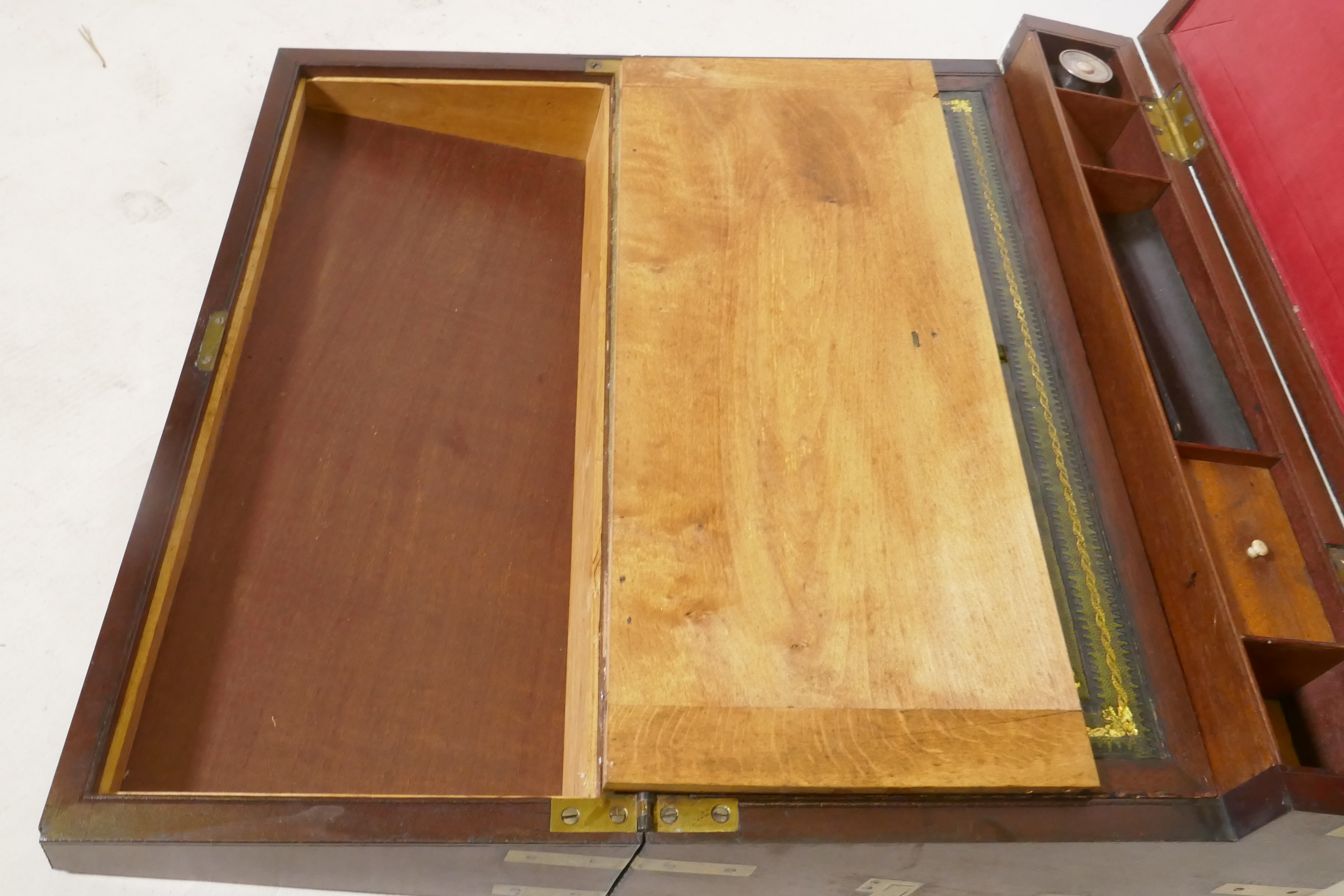 A C19th mahogany campaign writing slope with brass mounts and military style carrying handles, the - Image 7 of 8