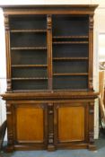 A William IV rosewood and mahogany bookcase in two parts, the upper with open shelves, the lower