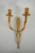 An ormolu two branch wall sconce in the form of an arrow quiver, 38cm high