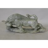 A Chinese carved soapstone figure of a bull, 58 x 28cm