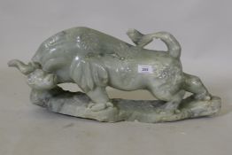 A Chinese carved soapstone figure of a bull, 58 x 28cm