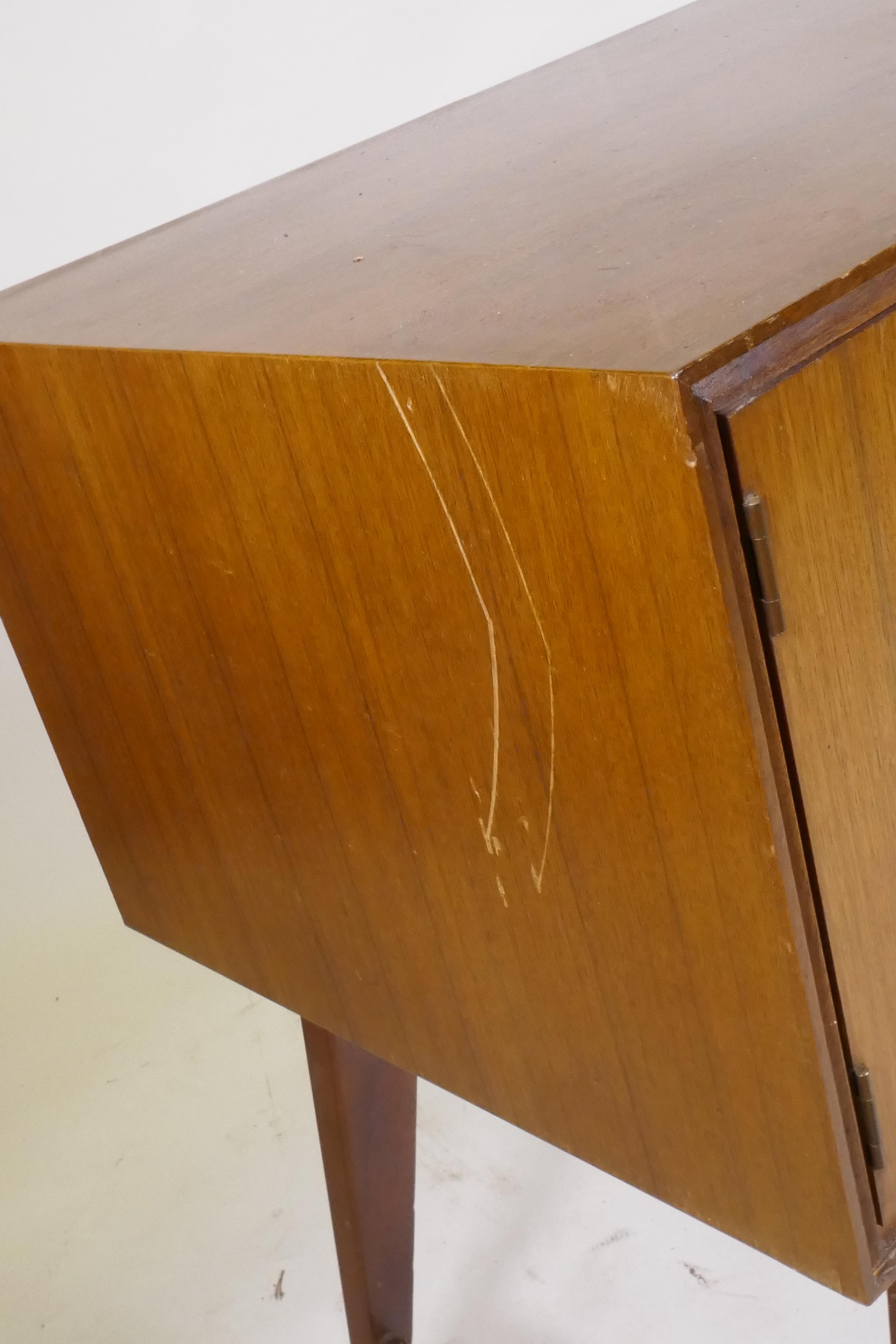 A mid century teak dressing table/low side cabinet, with two cupboards flanking two drawers, - Image 4 of 6