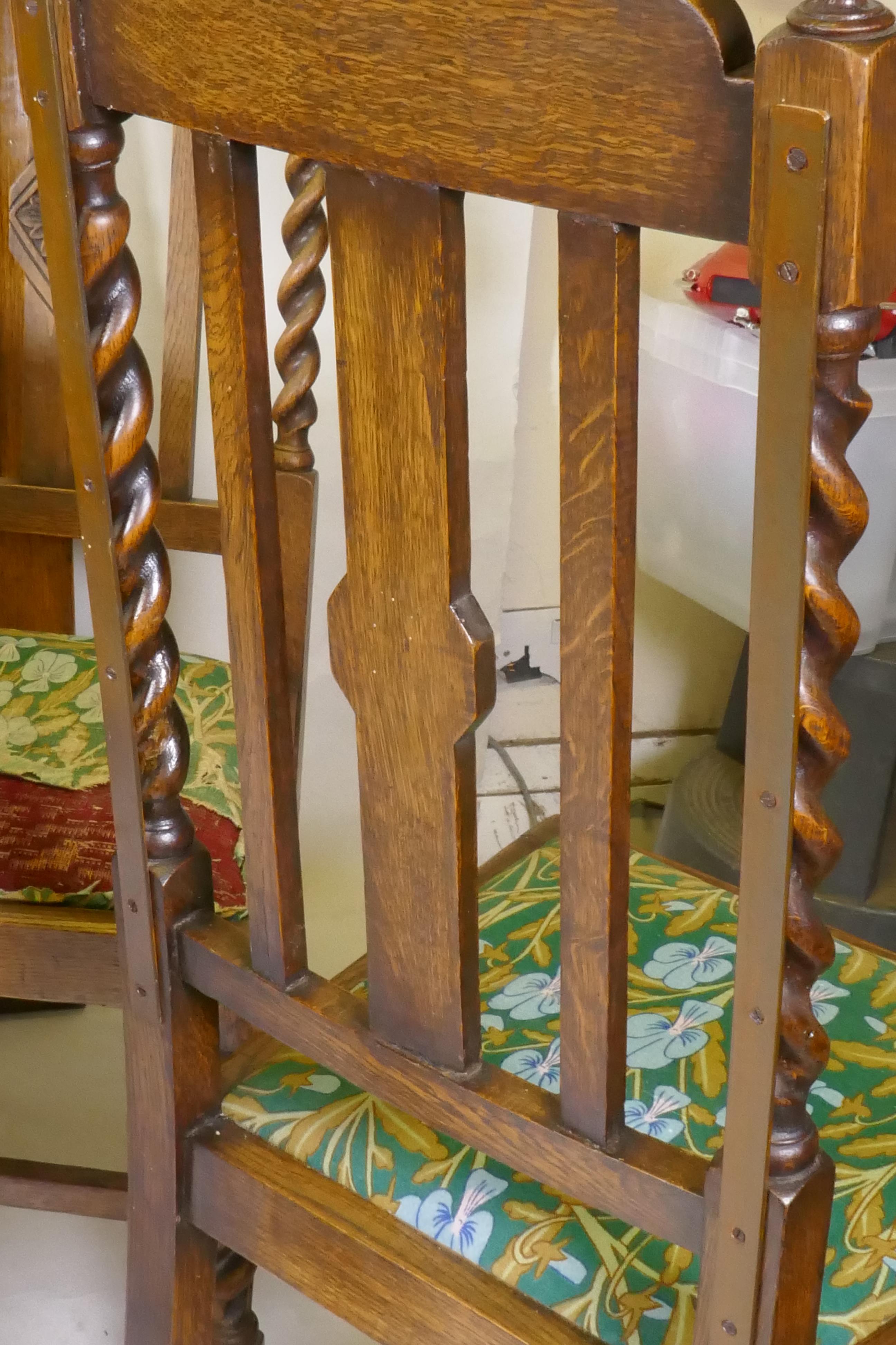 An early C20th oak wind out dining table, with extra leaf, raised on handed barley twist supports, - Image 7 of 7