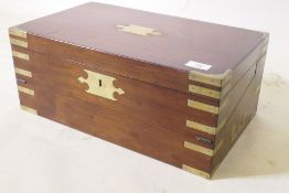 A C19th mahogany campaign writing slope with brass mounts and military style carrying handles, the