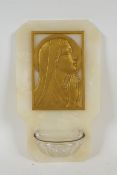 A vintage onyx stoup mounted with a gilt brass portrait of the Madonna in prayer, inscribed Tschudin