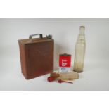 A vintage Shell Motor Spirit petrol can, an Esso one quart glass oil bottle, a can of Esso Brake &