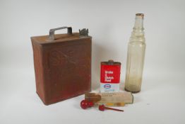 A vintage Shell Motor Spirit petrol can, an Esso one quart glass oil bottle, a can of Esso Brake &