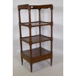 A Regency mahogany four tier etagere, with three quarter galleried top and shaped frieze, the