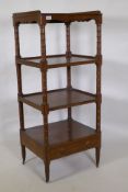 A Regency mahogany four tier etagere, with three quarter galleried top and shaped frieze, the