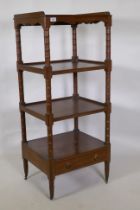 A Regency mahogany four tier etagere, with three quarter galleried top and shaped frieze, the