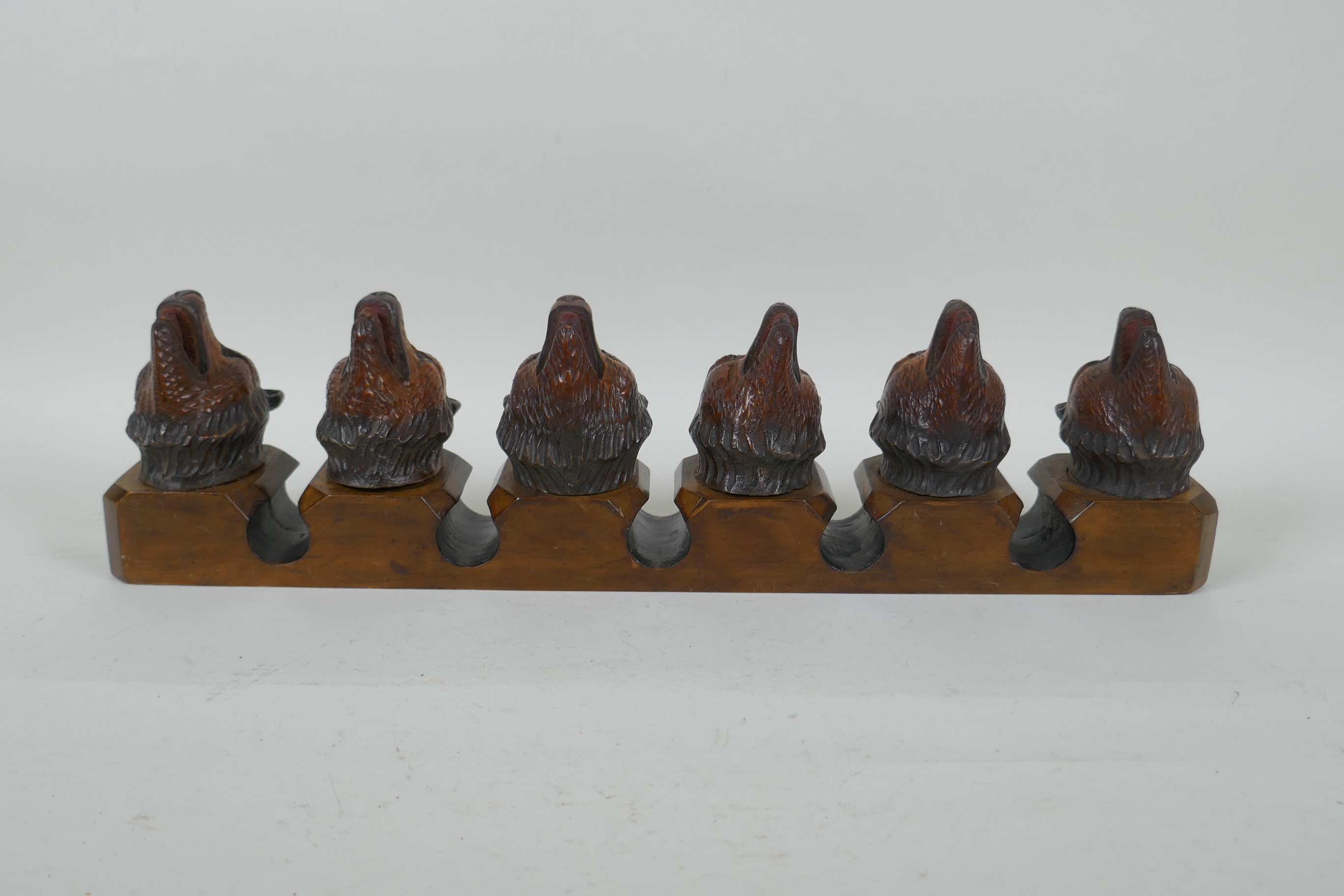 An antique Black Forest carved wood pipe rack with bear's head decoration, a pair of turned wood - Image 3 of 6