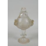 A Chinese moulded glass stem cup/censer and cover with kylin decoration, 15cm high