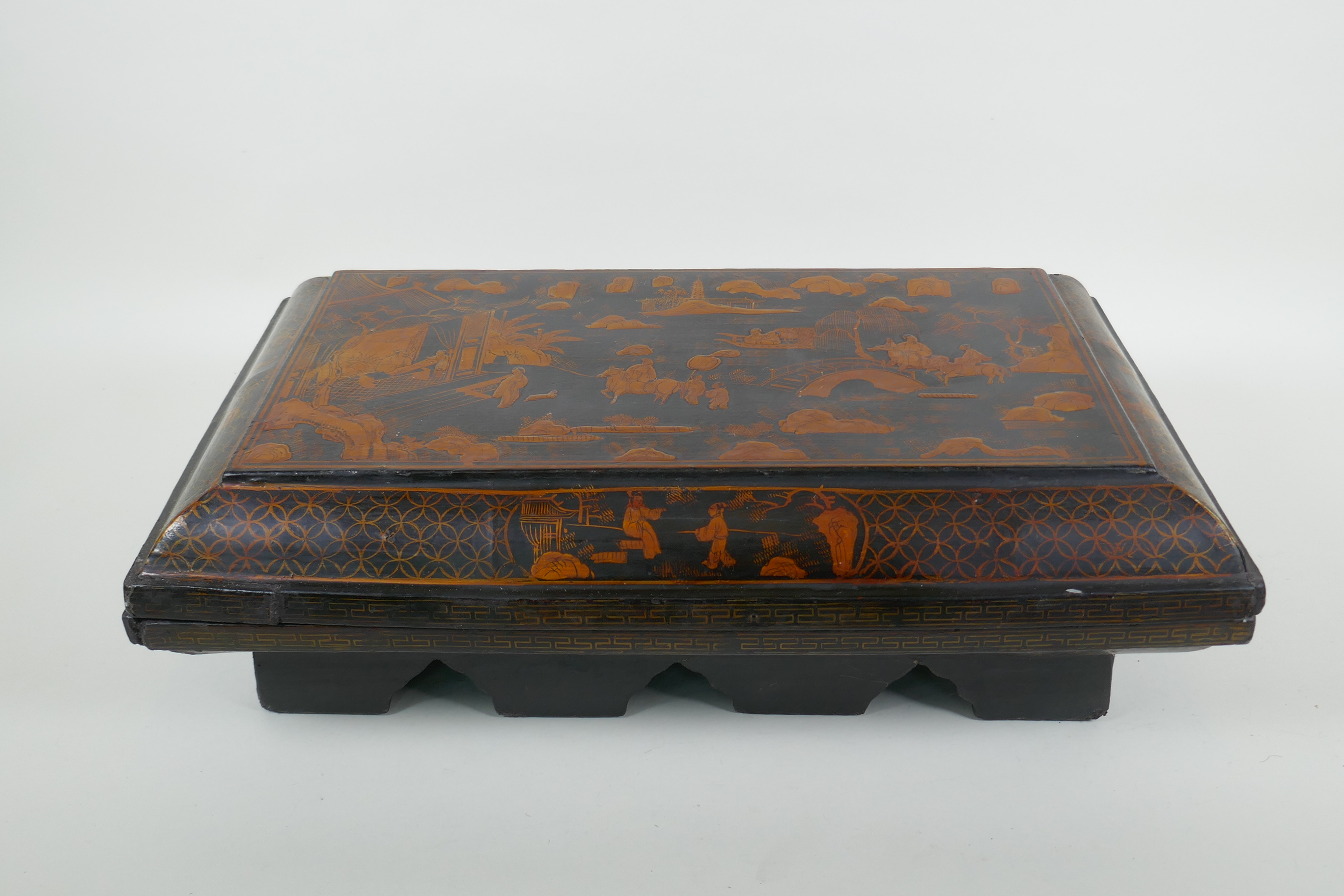 A Chinoiserie black lacquer box and cover decorated with figures in a landscape, 47 x 30cm