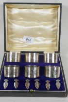 A cased set of six hallmarked napkin rings and markers, Birmingham 1925, Docker & Burn, 240g