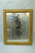 A mid C19th giltwood and composition picture frame, with moulded fruit decoration, fitted with a