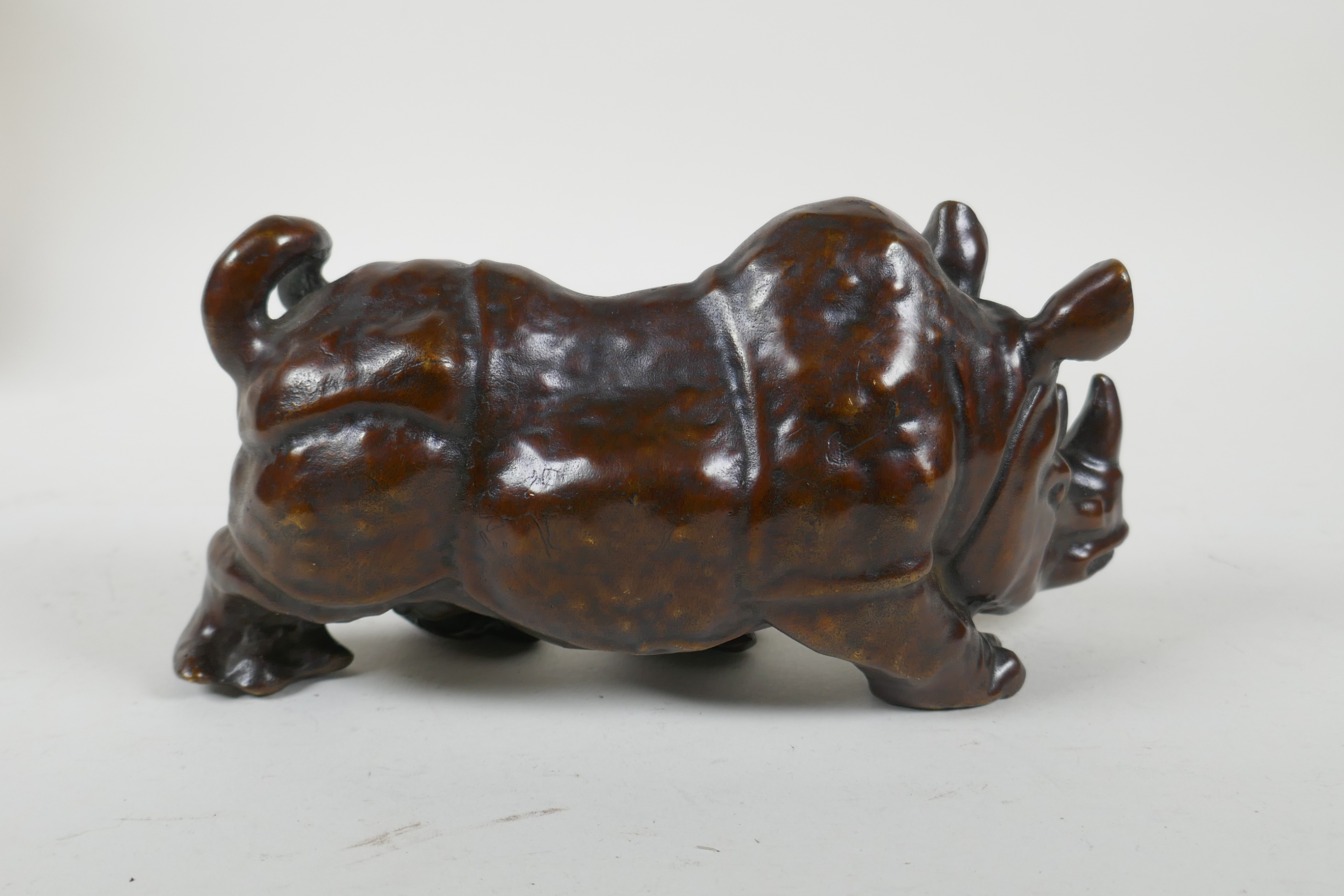 A filled bronze rhinoceros, 19cm long - Image 2 of 3