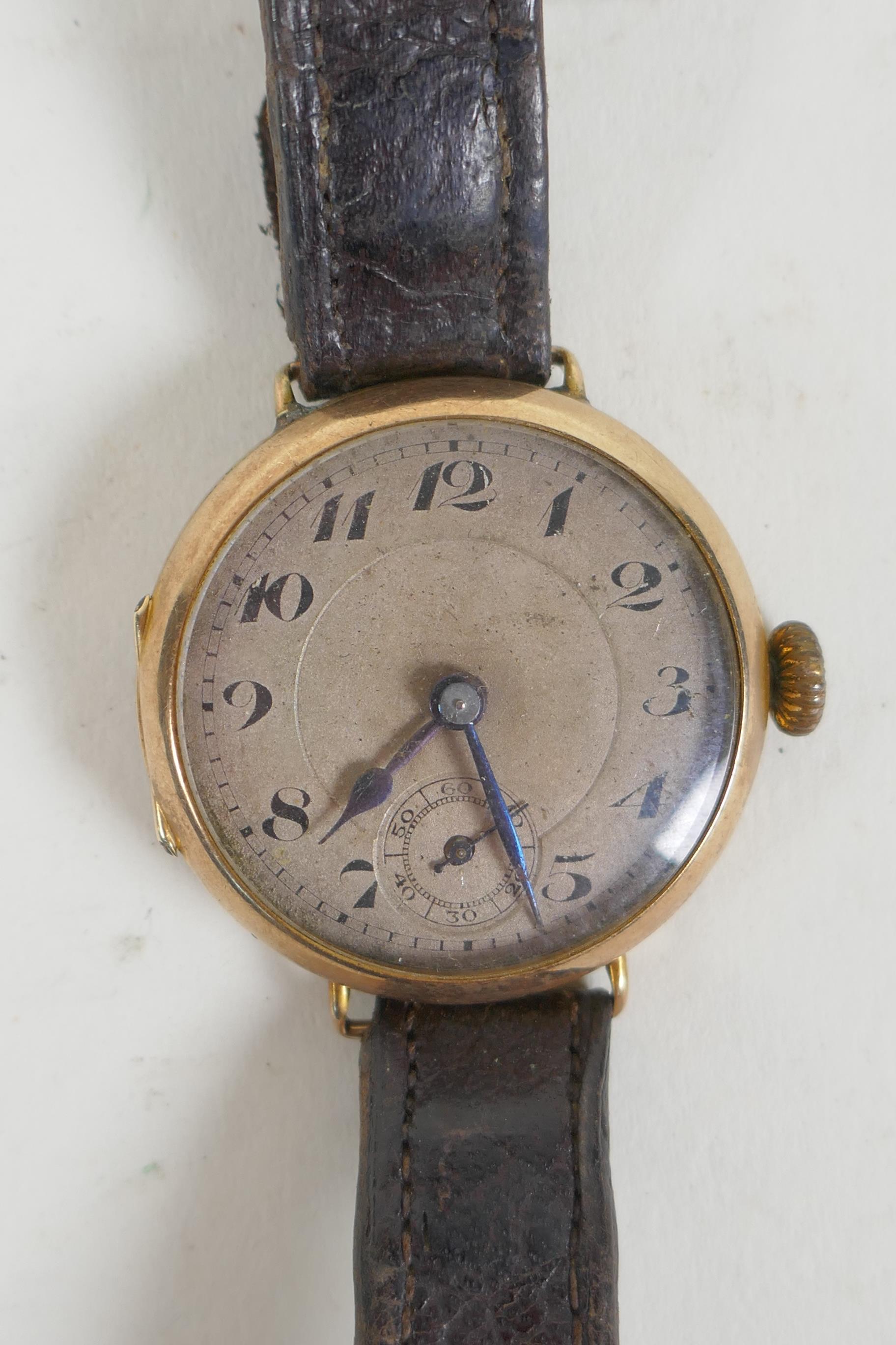 A 9ct gold cased wrist watch, the dial with Arabic numerals and subsidiary second dial, 3cm
