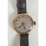 A 9ct gold cased wrist watch, the dial with Arabic numerals and subsidiary second dial, 3cm