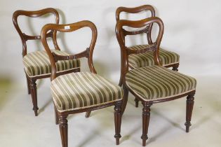 Set of four C19th mahogany kidney back chairs raised on turned reeded supports, stamped James Winter