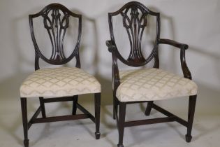 A set of eight (six plus two) Hepplewhite style shield back chairs, with over stuffed serpentine