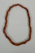 An amber beaded necklace, 56cm long, 60g