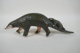 A cold painted bronze pangolin and its offspring, 32cm long