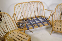 An Ercol hoop back cottage suite, settee and two arm chairs