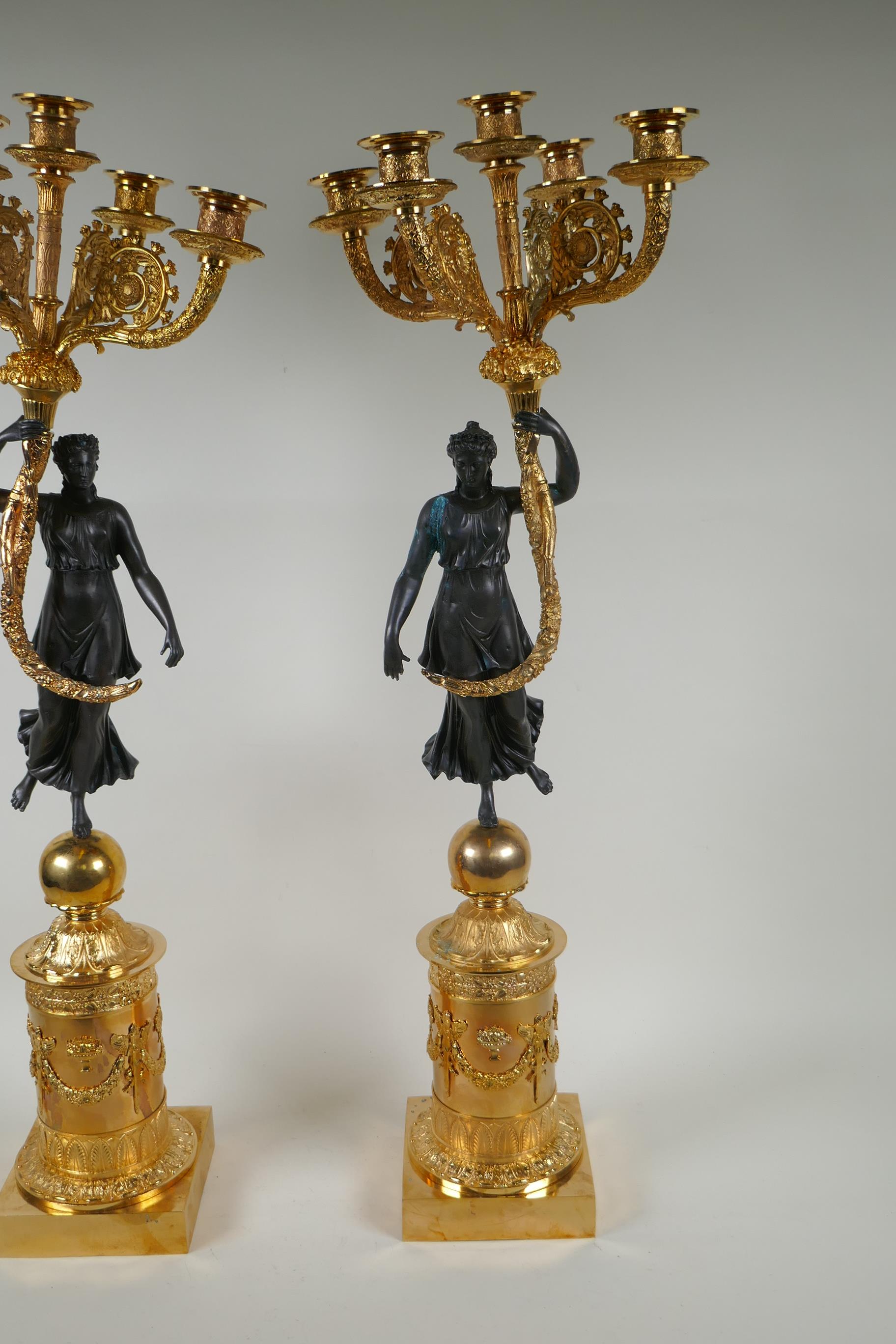 A pair of Regency style bronze and ormolu four branch candelabra in the form of classical women - Image 4 of 6