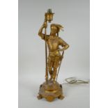 A gilt metal table lamp in the form of a cavalier, 44cm high