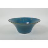 A Chinese teal crackle glazed porcelain bowl with a metal rim, with chased and gilt character