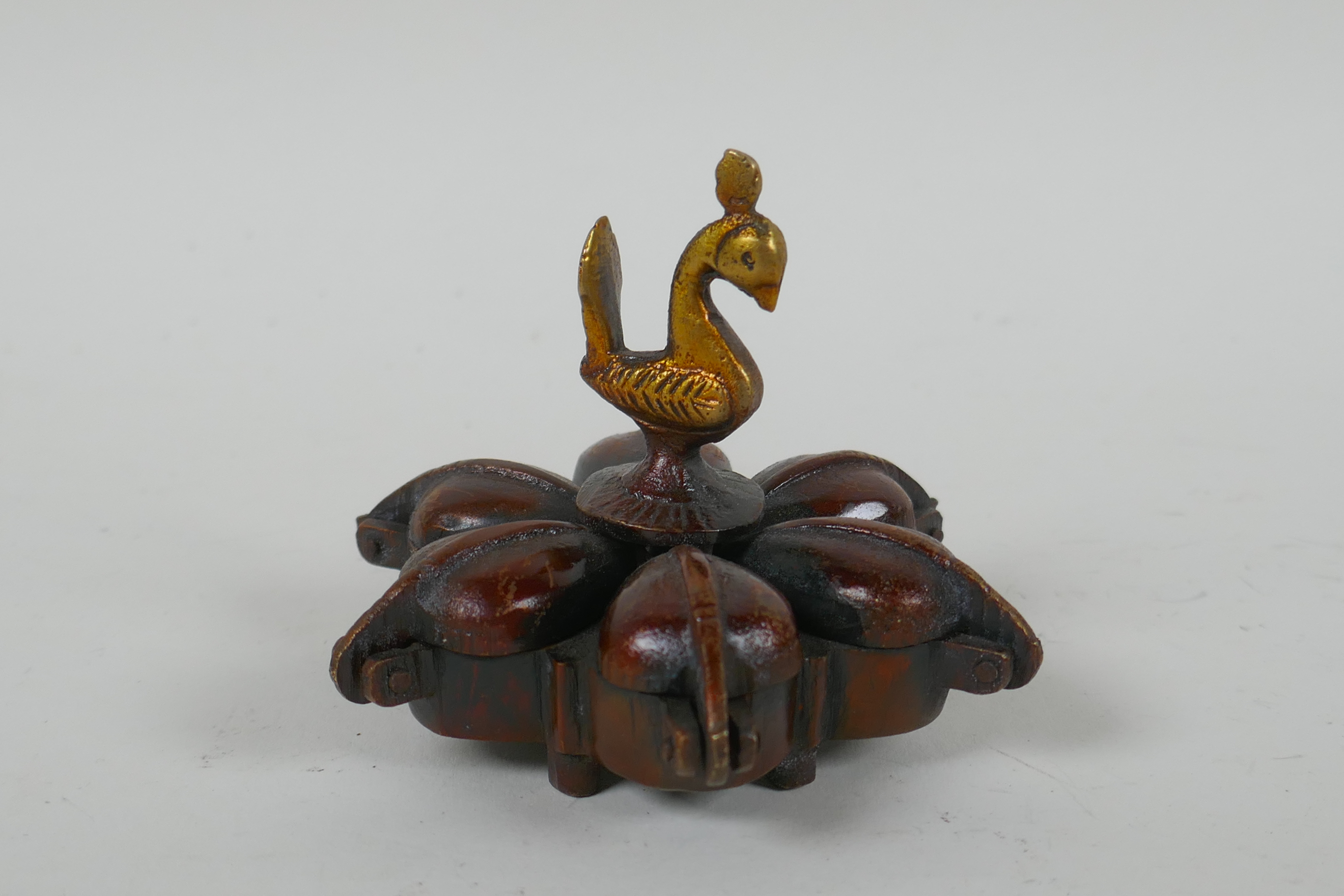 An Indian bronze six section tikka pot, a filled bronze Buddha's hand, and a Tibetan bronze vajra, - Image 2 of 5