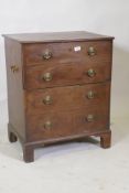 A Georgian mahogany commode with lift up top and false drawers, raised on bracket supports, 62 x