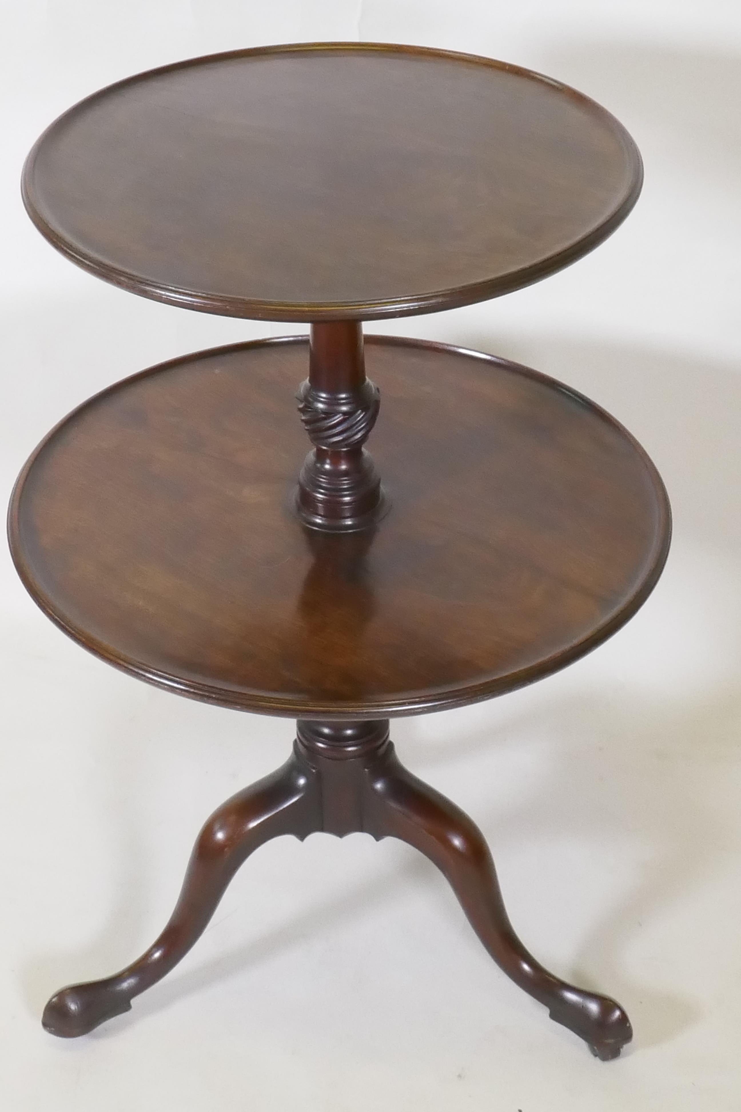 A Georgian mahogany two tier dumb waiter, raised on carved and turned column and tripod supports - Image 2 of 5