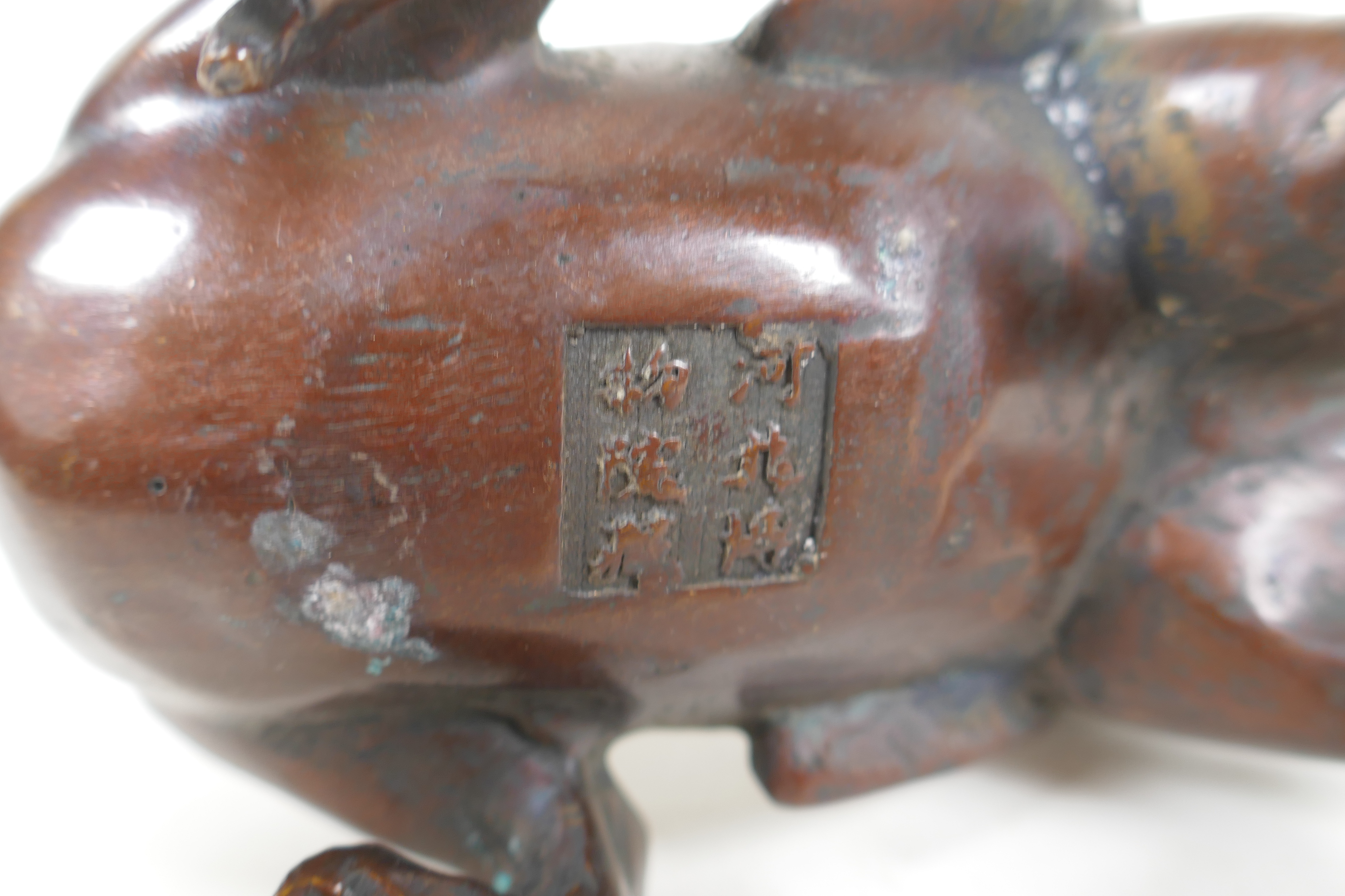 A Japanese filled bronze stylised dragon, 21cm long, indistinct 6 character mark to base - Image 5 of 5