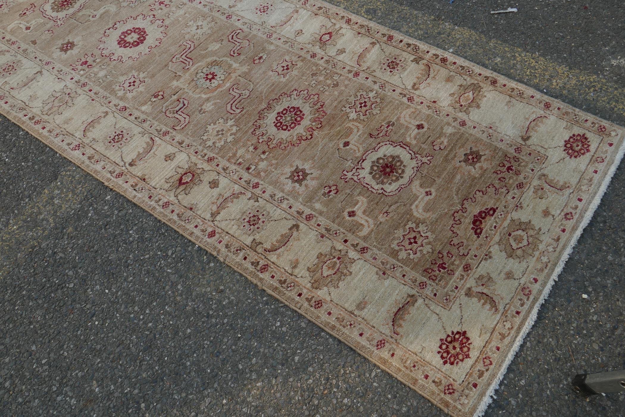 A cream ground wool Ziegler Mahal runner decorated with floral medallions, 85 x 350cm - Image 2 of 5