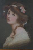 An early C20th portrait of a girl with roses in her hair, oil on millboard, 20 x 28cm
