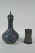 An Indian gilt brass and enamel surahi bottle and cover, and an Indian silver plated bidri vase with