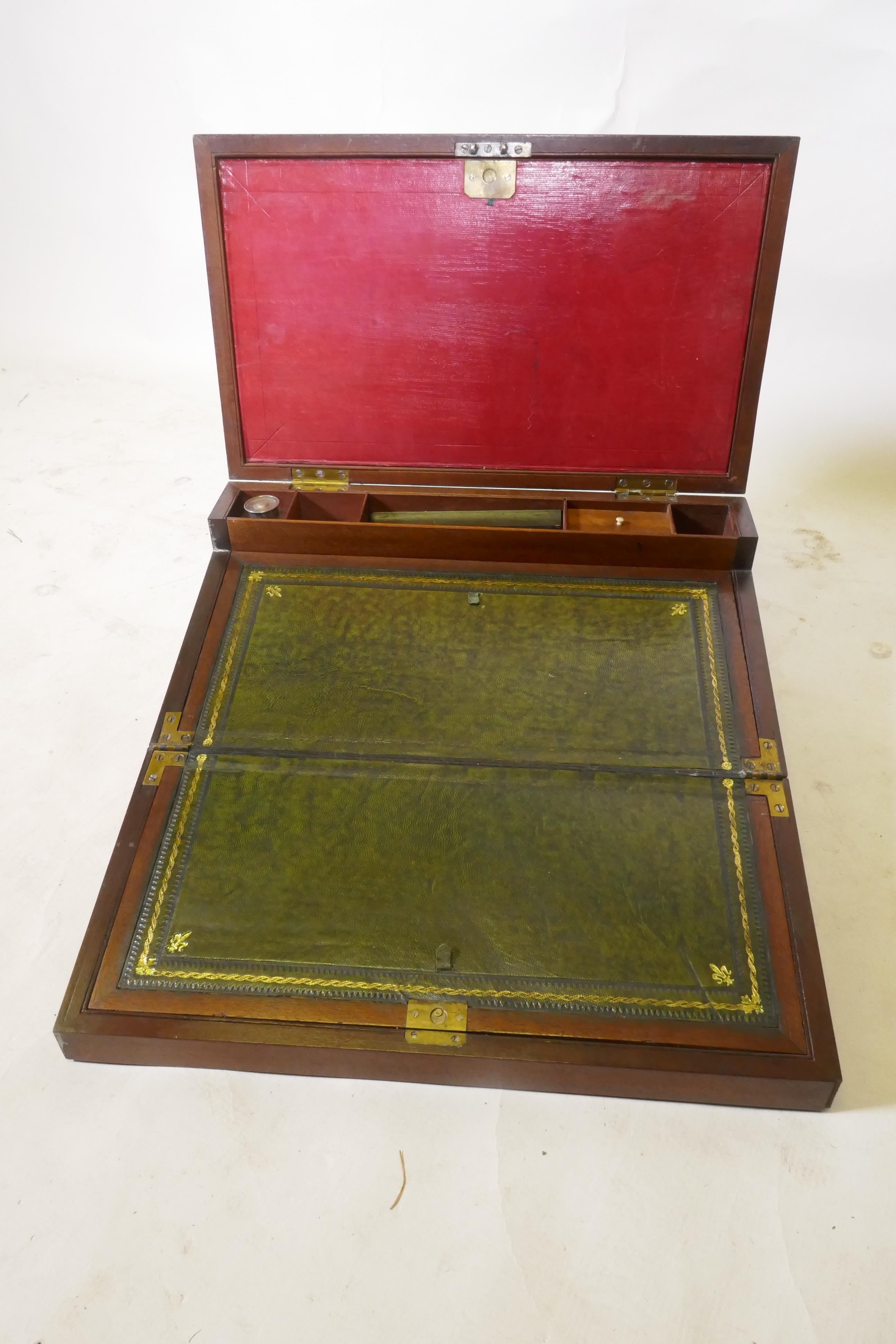 A C19th mahogany campaign writing slope with brass mounts and military style carrying handles, the - Image 4 of 8