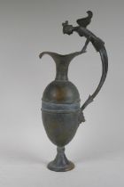 A Greco-Roman style bronze urn, the handle decorated with the bust of a siren, 48cm high