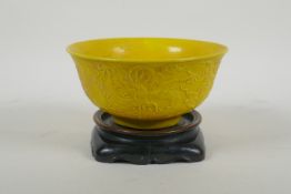 A yellow ground porcelain rice bowl with raised triple dragon decoration, Chinese YongZheng 6