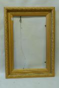 A C19th giltwood and composition picture frame with oak and acorn moulded decoration, 50 x 81.5cm